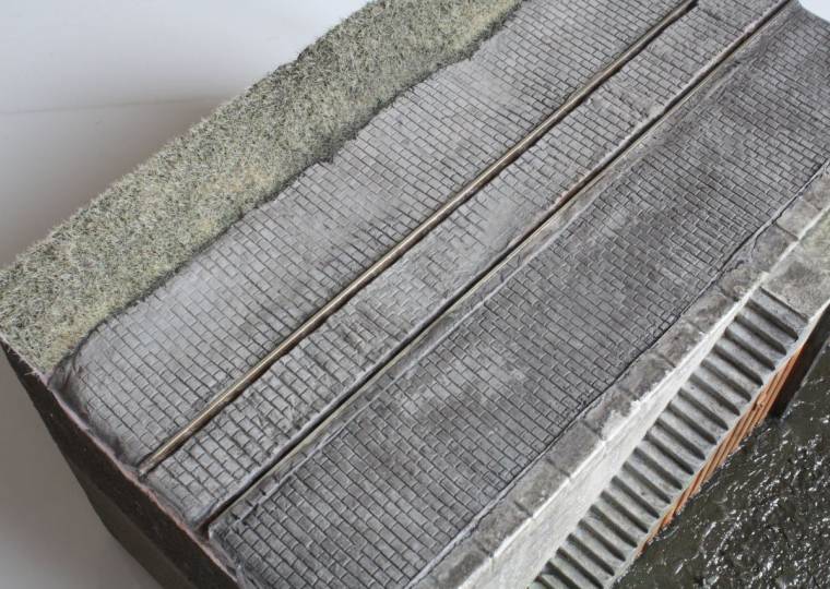 Farbgestaltung des geprägten Pflasters